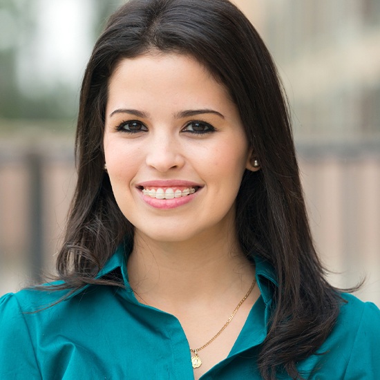 Woman with clear and ceramic braces smiling