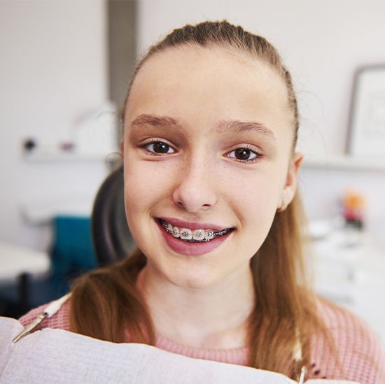 Girl in orthodontic chair during dentofacial orthopedic treatment
