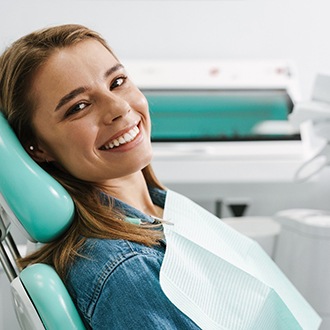 Woman smiling after finishing Invisalign in Webster