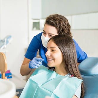 Webster orthodontist smiling with patient in reflection