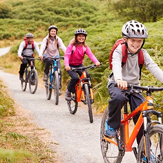 Group of kids riding their bikes outside