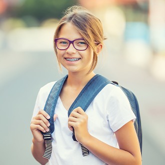 Preteen girl with braces smiling