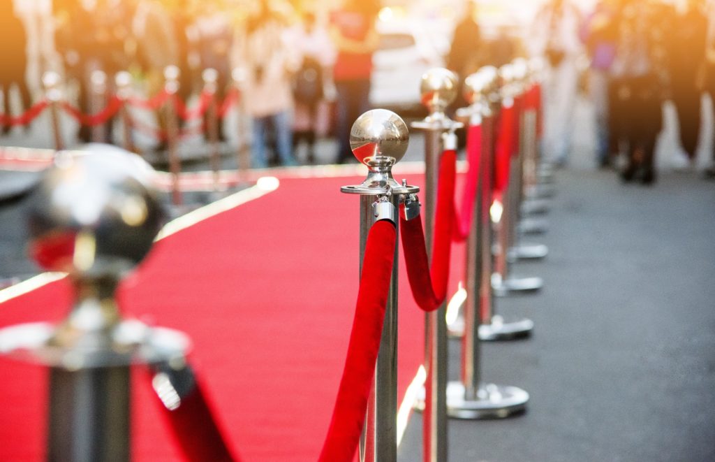 Closeup of stanchions next to red carpet event