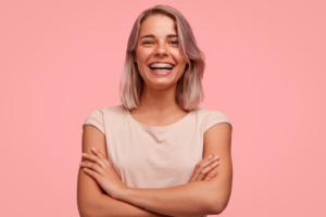 a patient with braces smiling 